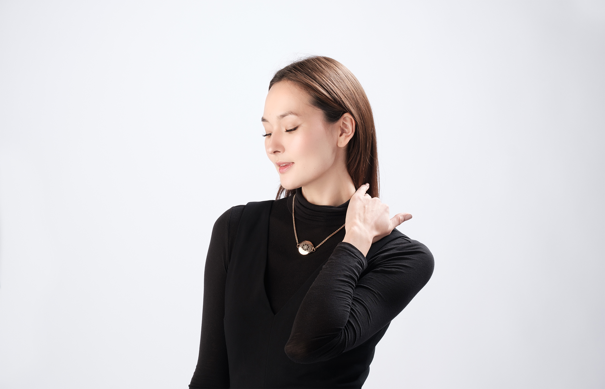 Woman wearing ResQ smart safety necklace with background voice recording feature