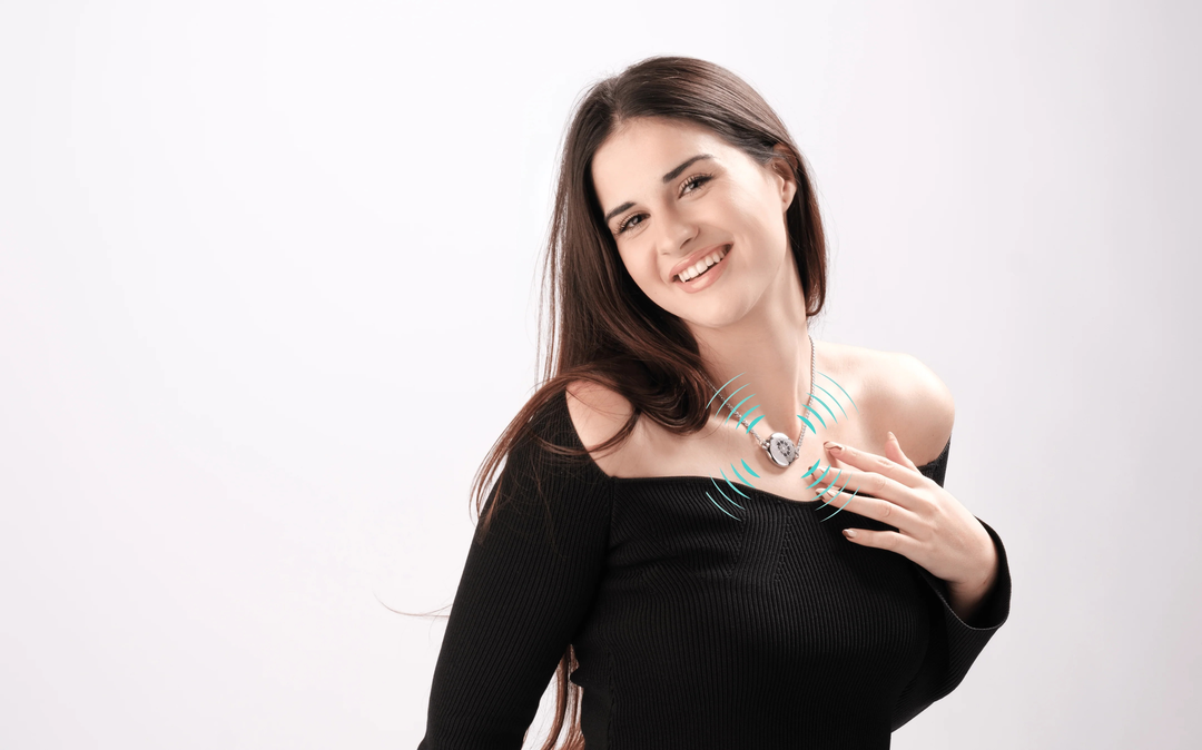 Smiling woman demonstrating ResQ wearable alert necklace with multi-level safety alarm system.