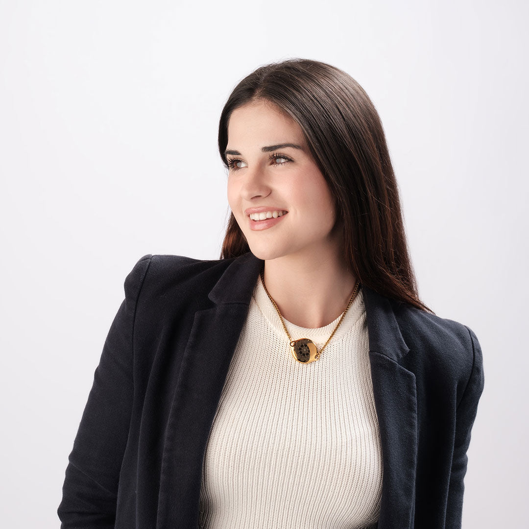 Woman wearing ResQ Shakti Safety Necklace for woman (Gold) with emergency alert technology for women’s protection.