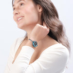 Woman modeling fashionable safety bracelet by ResQ - elegant wearable personal alarm device for women's security.