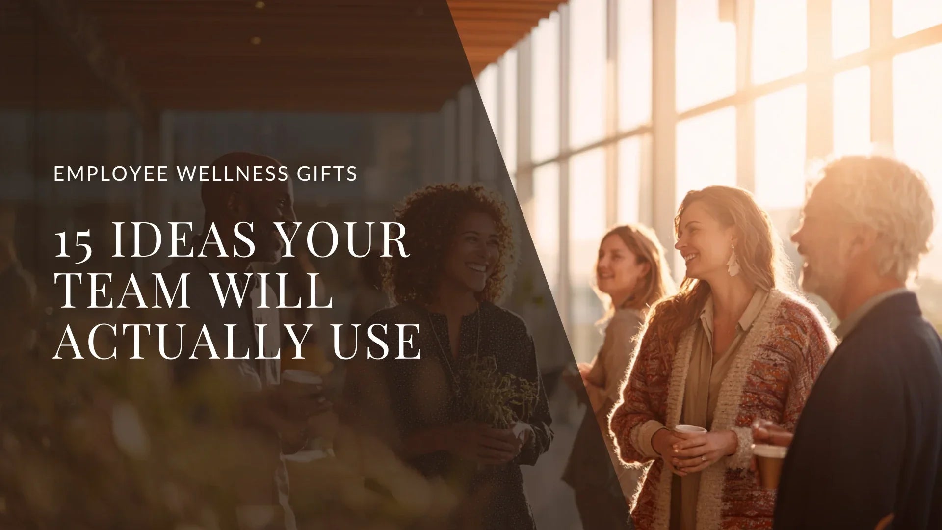 Group of diverse colleagues talking in a sunlit office, illustrating the impact of thoughtful employee wellness gifts on team culture.