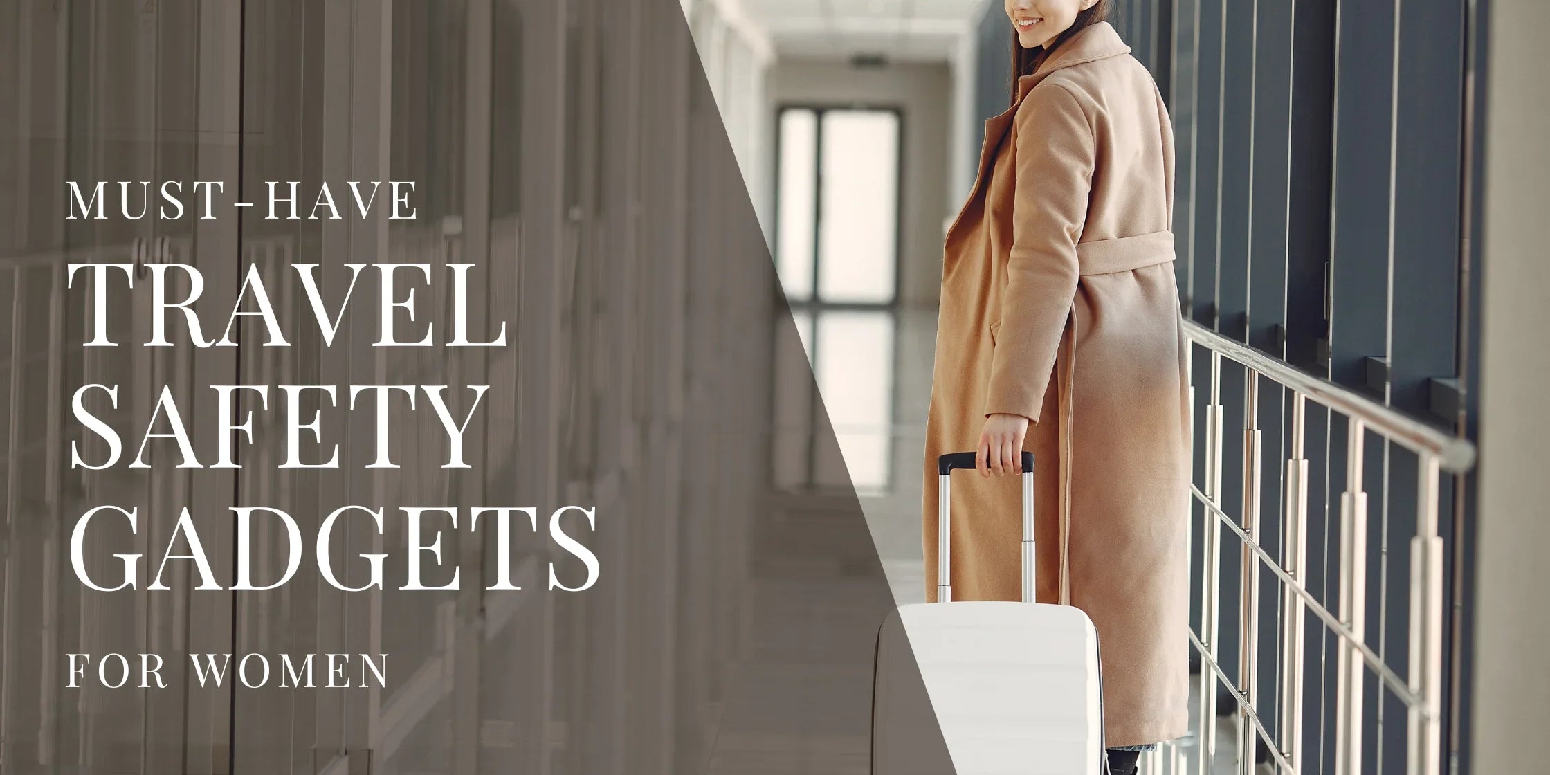 A woman in a long beige coat walks through an airport corridor pulling a white suitcase, smiling over her shoulder as she heads toward the terminal.