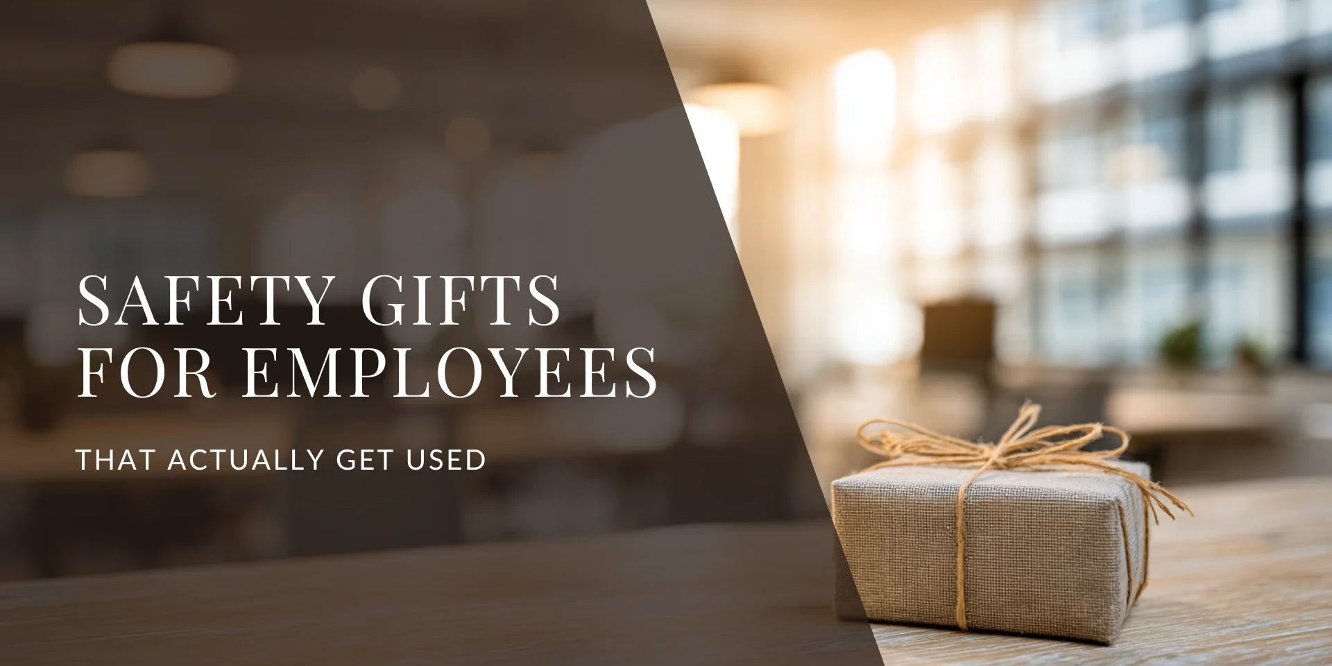 A minimalist, elegantly wrapped gift box sitting on a light wood desk in a bright, modern sun-drenched office, symbolizing a corporate culture of care and employee safety.