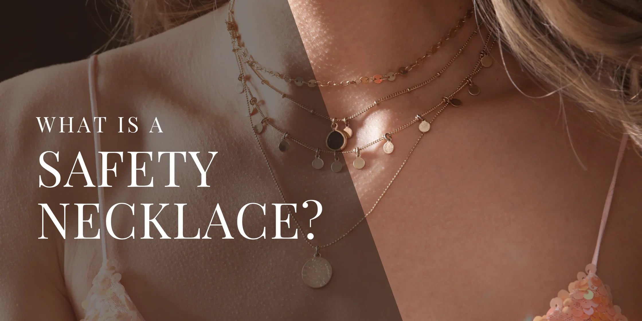 Close up of a woman wearing layered gold necklaces, including small charms and a round pendant, with soft warm lighting on her neck and shoulders.