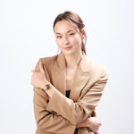 Woman wearing ResQ Maitri safety bracelet with gold finish for personal security and protection.