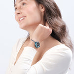 Woman wearing blue ResQ Maitri safety bracelet (Blue) with emergency alert technology for women’s protection.
