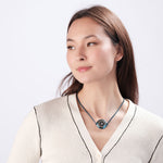 Woman wearing ResQ Shakti Safety Necklace for woman (Blue) with emergency alert technology for women’s protection.