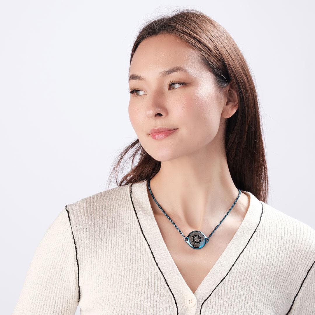Woman wearing ResQ Shakti Safety Necklace for woman (Blue) with emergency alert technology for women’s protection.