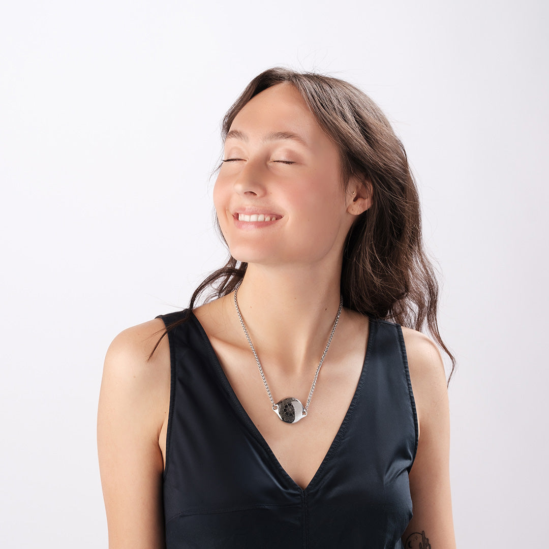 Woman wearing ResQ Shakti Safety Necklace for woman with emergency alert technology for women’s protection.