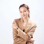 Professional businesswoman wearing ResQ safety bracelet - stylish personal alarm jewelry for workplace protection and women's security.